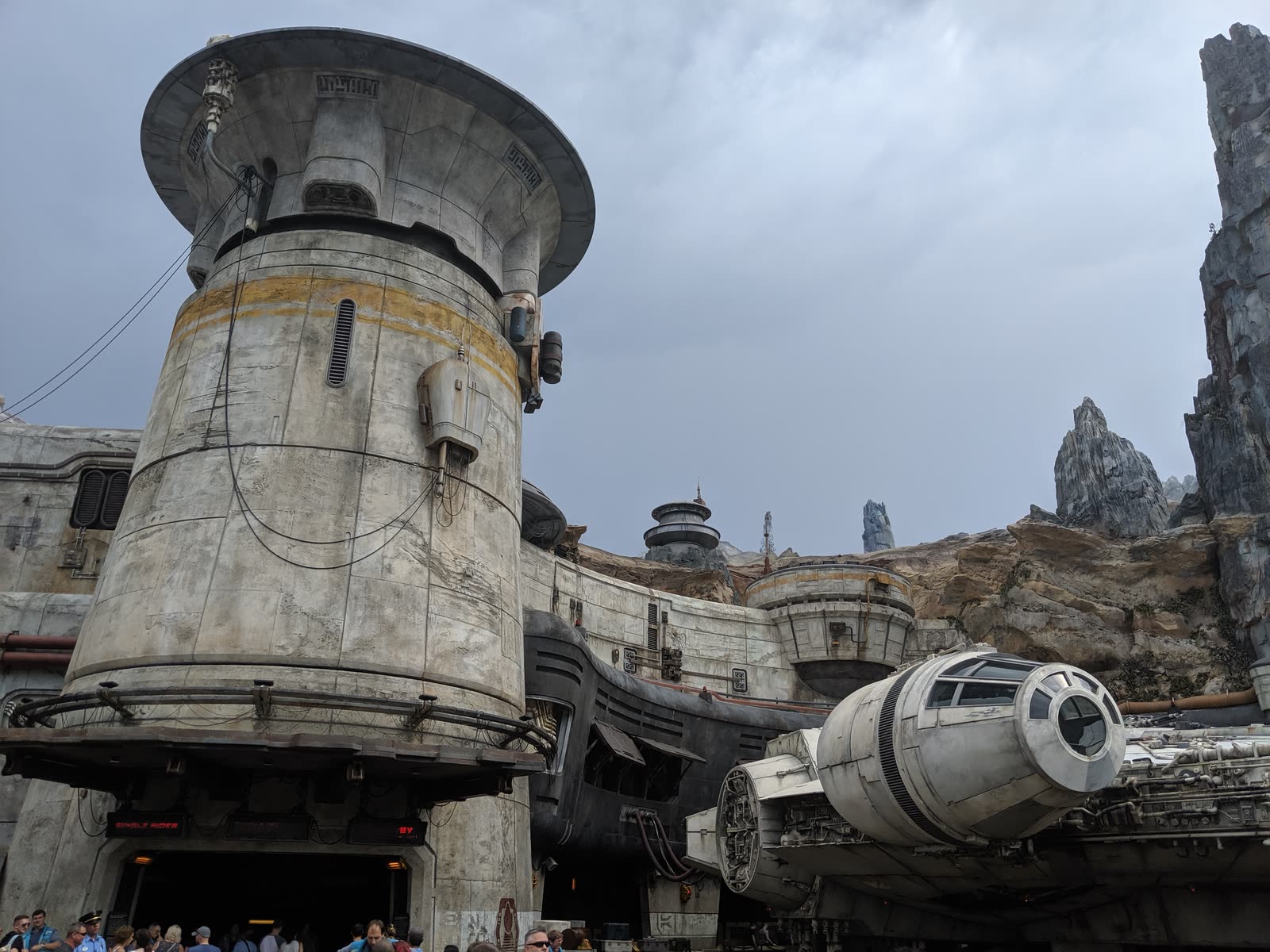 The Millennium Falcon parked outside the entrance to Smugglers Run at Star Wars: Galaxy's Edge