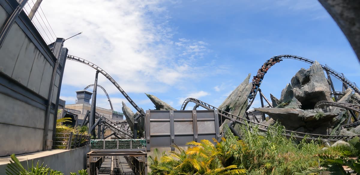 Jurassic World VelociCoaster launch coaster with riders mid-launch