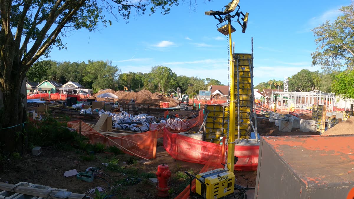 Construction site of Tropical Americas at Disney's Animal Kingdom, showing structural steel formwork and a tower crane on the former DinoLand U.S.A. footprint