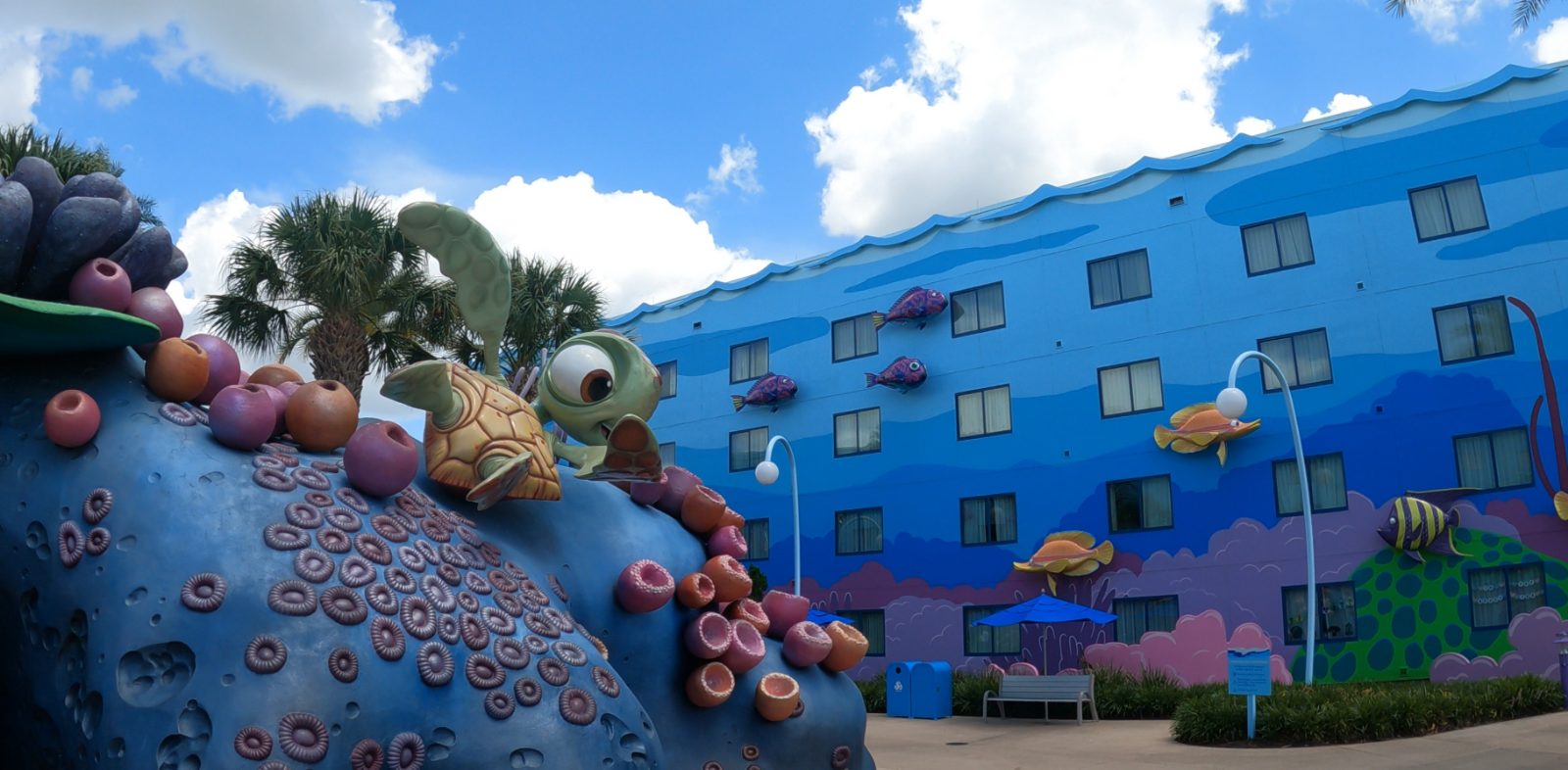 Crush the sea turtle statue in front of the Finding Nemo-themed mural building at Disney's Art of Animation Resort