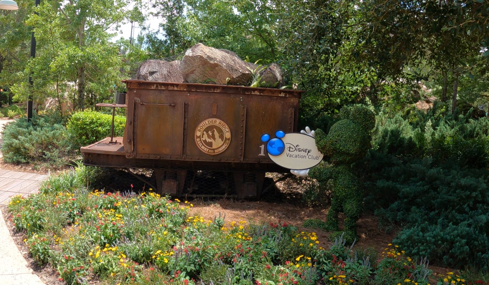 The Boulder Ridge Railway and Mining Co. mine-cart display at Copper Creek Villas & Cabins, Disney Vacation Club signage visible alongside